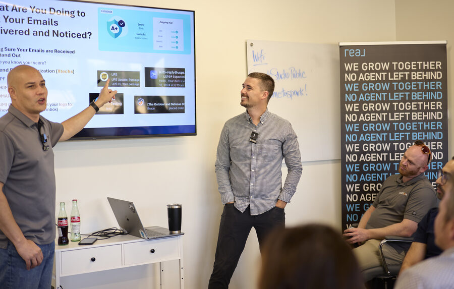 Co-founder Brandon Walcott teaching marketing on screen at a live Secret Sauce event